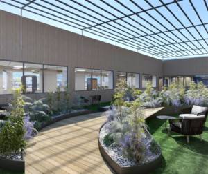 Zona de oficina con plantas y cabina acústica